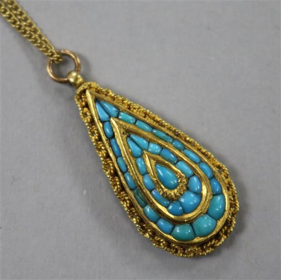 A late 19th/early 20th century Indian? yellow metal and turquoise set teardrop shaped pendant, 32mm.